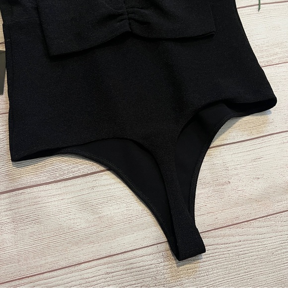 EXPRESS Ribbed Plunge Neck Bow Back Thong Bodysuit - Picture 10 of 16